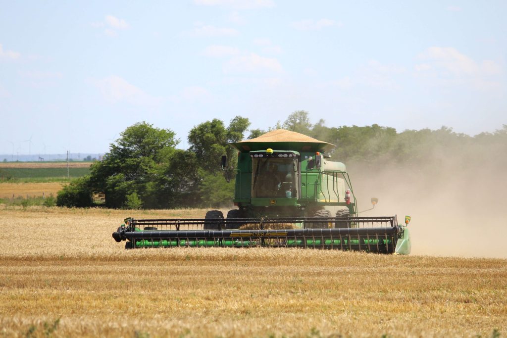 full-Kansas-combine-cutting-wheat-field
