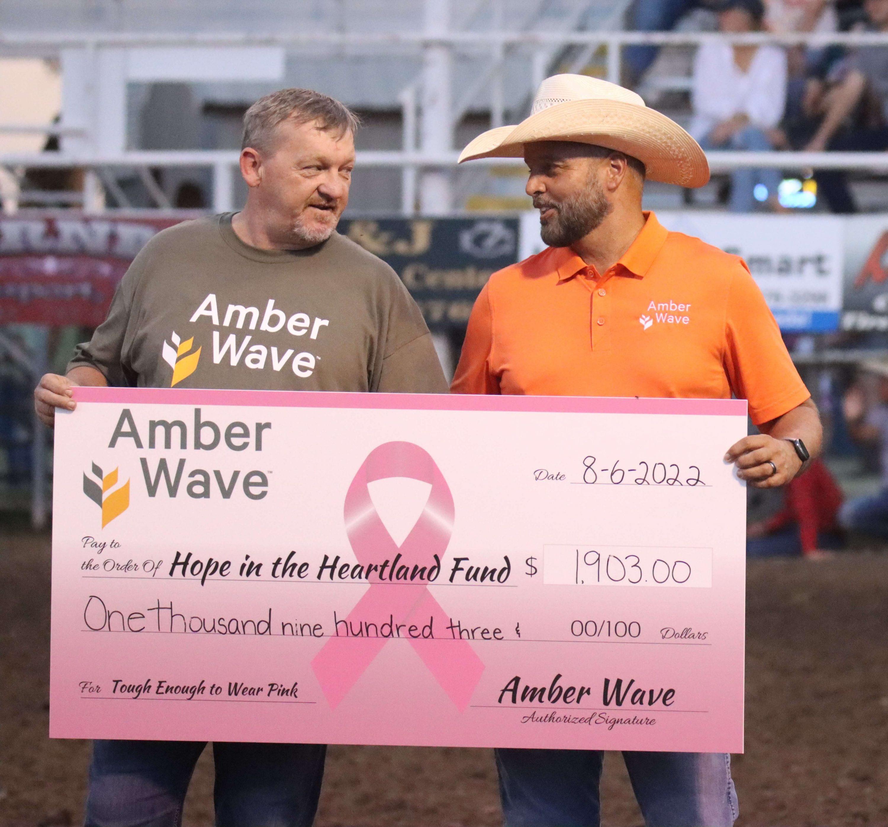 Amber Wave makes a donation to the Hope in the Heartland fund during Kansas' Biggest Rodeo 2022